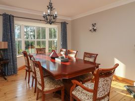 A dining room with a table and chairs at The Lodge Bolinahaney Bunclody, County Wexford
