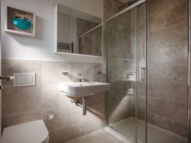A bathroom with a shower and sink at Polview in Newquay