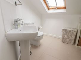 A bathroom with a sink and toilet at Bobbin Mill Cottage Ulverston