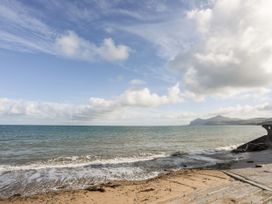 A beach scene with sand and sea at Gelli - Morfa Nefyn Morfa Nefyn