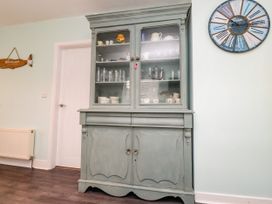 A cabinet displaying glassware in a kitchen at Gelli - Morfa Nefyn