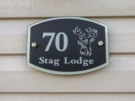 A plaque with the number 70 and Stag Lodge at Stag Lodge, Caravan 70 Great Yarmouth