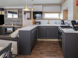 A kitchen with modern appliances at Stag Lodge, Caravan 70, Great Yarmouth