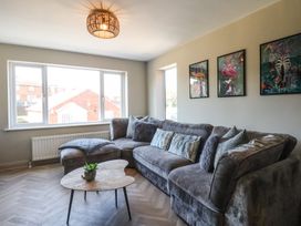 A living room with a sofa and coffee table at Falcon Luxe in Whitby