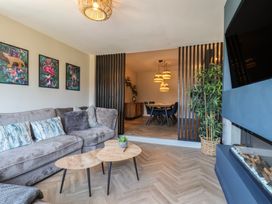 A living room with a sofa and coffee table at Falcon Luxe in Whitby
