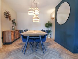 A dining room with a table and chairs at Falcon Luxe in Whitby