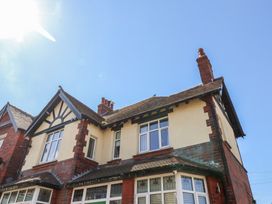 An exterior view of a house with a chimney and windows at Falcon Luxe in Whitby