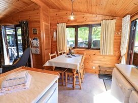 A dining room with a table and chairs at Watendlath in Keswick