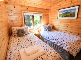 A bedroom with two beds and a window at Watendlath in Keswick