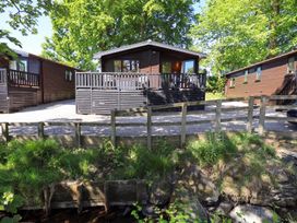 A cabin with a deck and gravel path at Watendlath in Keswick