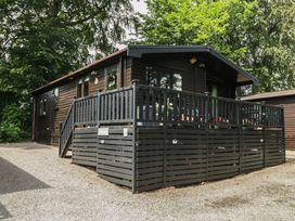 A cabin with a deck and parking area at Watendlath in Keswick