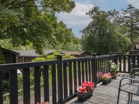 A deck with flower pots and trees at Watendlath in Keswick