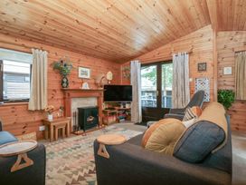 A living room with a television and fireplace at Watendlath in Keswick