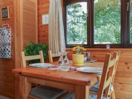 A dining room with a table and chairs at Watendlath in Keswick