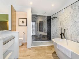 A bathroom with a shower and bathtub at Pear Tree in Thirsk