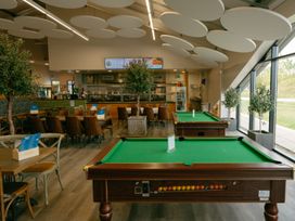 A restaurant area with pool tables and seating at Pear Tree Carlton Miniott near Thirsk