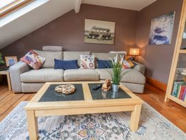 A living room with a sofa and coffee table at The Studio on the Crescent in Whitby