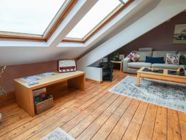 A living room with a sofa and skylights at The Studio on the Crescent in Whitby