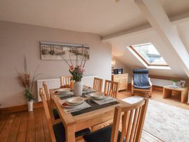 A dining room with a table and chairs at The Studio on the Crescent Whitby