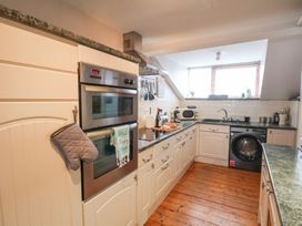 A kitchen with appliances and utensils at The Studio on the Crescent Whitby