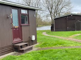A cabin near water at Hoburne Cotswolds - Holiday Accommodation 10757 Cirencester