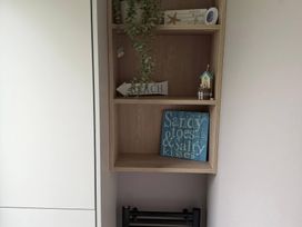A shelf with decor items at Primrose Valley Holiday Park - Holiday Accommodation 10790 in Filey
