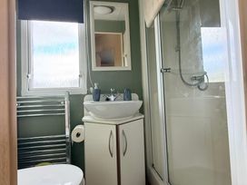 A bathroom with toilet, sink, and shower at Cala Gran Holiday Park - Holiday Accommodation 10830 in Fleetwood