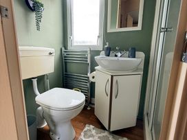 A bathroom with a sink and toilet at Cala Gran Holiday Park - Holiday Accommodation 10830 Fleetwood