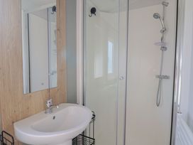 A bathroom with a sink and shower at Littlesea Holiday Park - Holiday Accommodation 13127 in Weymouth