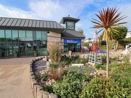 An outdoor area with a welcome sign and landscaped garden at Littlesea Holiday Park - Holiday Accommodation 13127, Weymouth