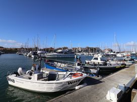 A marina with various boats docked at Littlesea Holiday Park - Holiday Accommodation 13127 in Weymouth