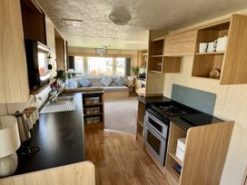 A kitchen with a stove and sink at Thornwick Bay Holiday Village - Holiday Accommodation 15653, Bridlington