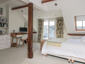 A bedroom with a desk and computer at Fastnet at Nonsuch House Kingswear, Devon