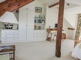 A bedroom with a desk and dresser at Fastnet at Nonsuch House, Kingswear, Devon