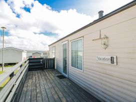 A vacation home exterior with a deck at WigBay Holiday Park - Holiday Accommodation 16774 Stranraer