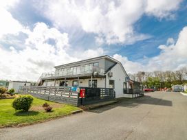 A building with steps and a railing at WigBay Holiday Park - Holiday Accommodation 16774 in Stranraer