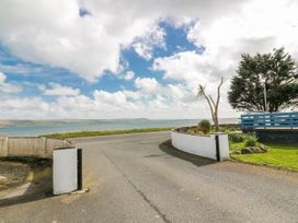 A view of a coastal road leading to the sea at WigBay Holiday Park - Holiday Accommodation 16774 Stranraer