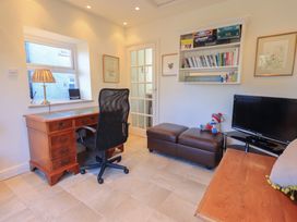 An office with a desk and chair at 2 Lupton Hall Cottages in Carnforth