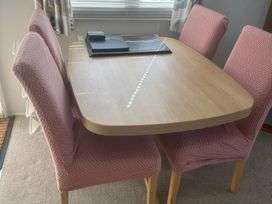 A dining room with a table and chairs at Freshwater Beach Holiday Park - Holiday Accommodation 17116 near Burton Bradstock