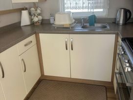 A kitchen with a sink and countertop at Freshwater Beach Holiday Park - Holiday Accommodation 17116 near Burton Bradstock