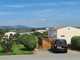 a holiday caravan park with a car parked in front at Hafan y Mor Haven - Holiday Accommodation 18358, Pwllheli