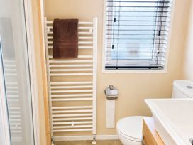 A bathroom with towel rail and sink at Trecco Bay - Holiday Accommodation 18463, Porthcawl