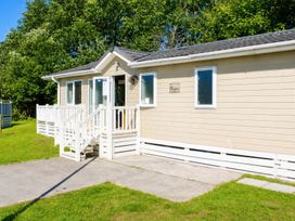 A house with steps and grass at Trecco Bay - Holiday Accommodation 18463, Porthcawl