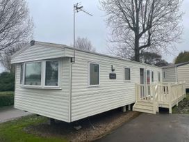 A caravan with steps and windows at Marton Mere Holiday Village - Holiday Accommodation 18865 Blackpool