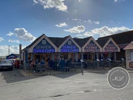 a row of food stalls including fish and chips and kebabs at Seaview Caravan Park - Holiday Accommodation 18940 in Ingoldmells