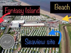 an aerial view showing Fantasy Island, beach, and Seaview site at Seaview Caravan Park - Holiday Accommodation 18940 in Ingoldmells