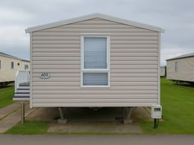 A static caravan with a window at Whitehouse Leisure Park - Holiday Accommodation 19055 Towyn, Abergele