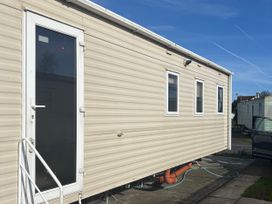 A mobile home exterior with door and windows at Southview Holiday Park - Holiday Accommodation 19123 Skegness