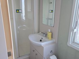 A bathroom with a sink and shower at Littlesea Holiday Park - Holiday Accommodation 19270 in Weymouth