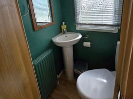 A bathroom with a sink and toilet at Littlesea Holiday Park - Holiday Accommodation 19270, Weymouth